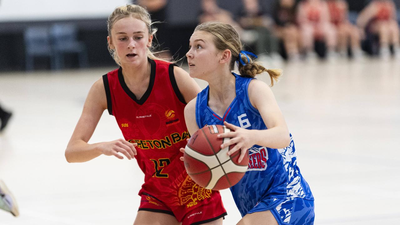 Samantha Hunter (right) of Toowoomba Mountaineers and Jessa Lowe-Barnsdale of Moreton Bay Suns in SQJBC U18 Women round 3 basketball at Toowoomba Grammar School, Sunday, October 20, 2024. Picture: Kevin Farmer