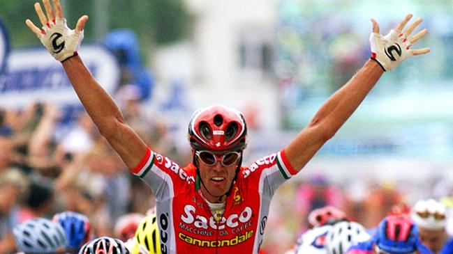 Cycling - Italian cyclist Mario Cipollini crossing line to win seventh stage of Tour de France race. He became the first cyclist to win four successive Tour de France stages.