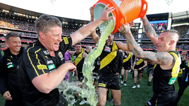 Dusty pours Gatorade over two-time premiership coach Hardwick. Pic: Michael Klein.