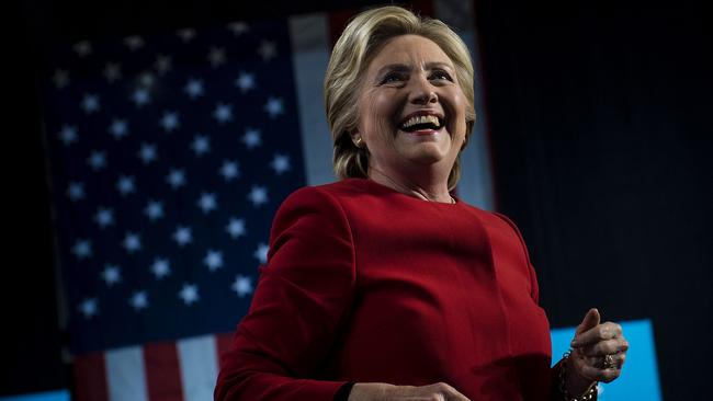 Democratic presidential nominee Hillary Clinton arrives to speak at a rally at the Grand Valley State University Fieldhouse on November 7, 2016 in Allendale, Michigan. (AFP PHOTO/Brendan Smialowski)