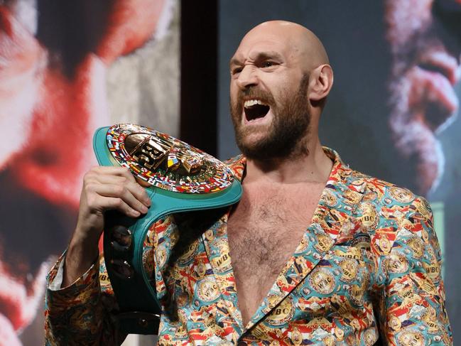 LAS VEGAS, NEVADA - OCTOBER 06: WBC heavyweight champion Tyson Fury yells during a news conference at MGM Grand Garden Arena on October 6, 2021 in Las Vegas, Nevada. Fury will defend his title against Deontay Wilder on October 9 at T-Mobile Arena in Las Vegas.   Ethan Miller/Getty Images/AFP == FOR NEWSPAPERS, INTERNET, TELCOS & TELEVISION USE ONLY ==