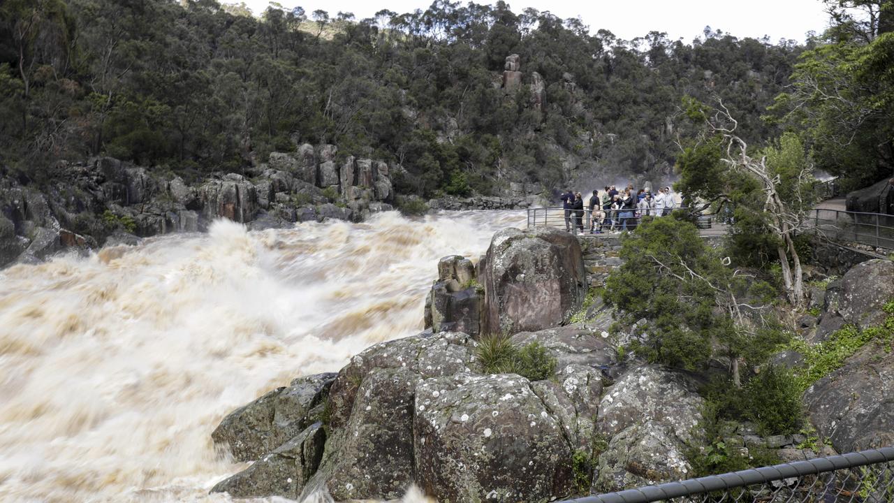 People come to see the floodwaters flow through the Cataract Gorge in Launceston. Sunday October 16th 2022. Picture: Grant Viney