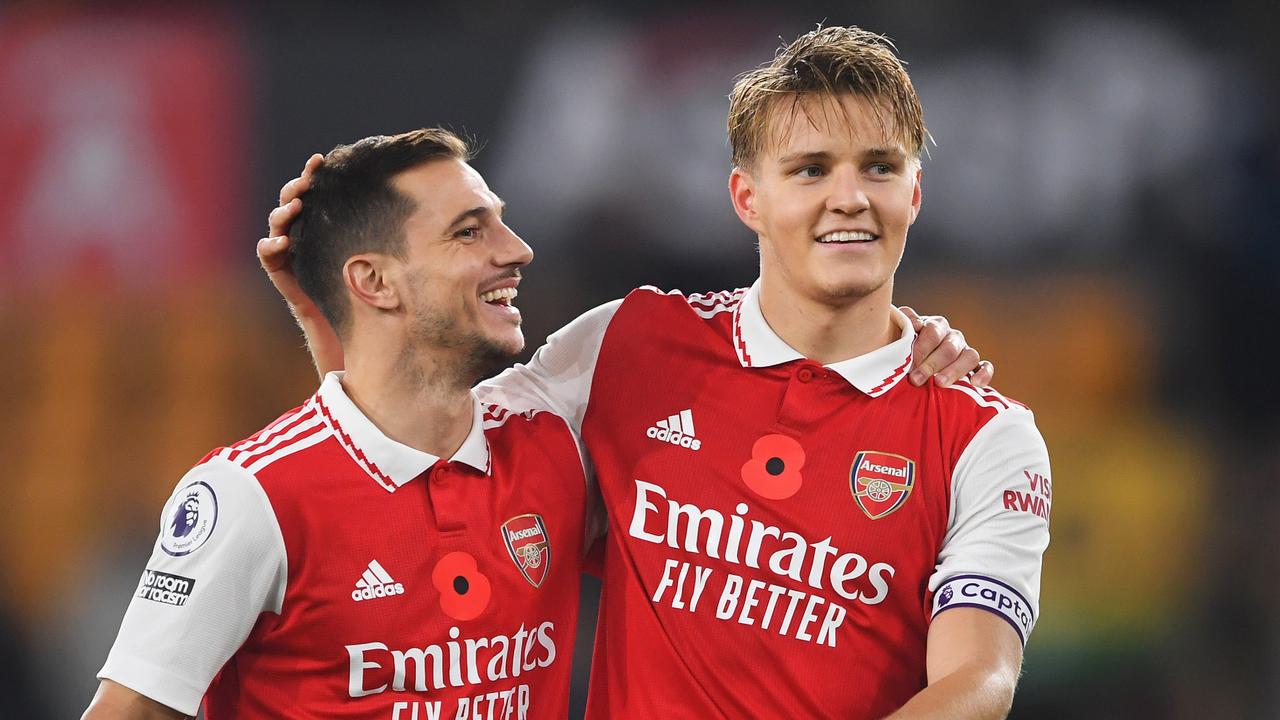 WOLVERHAMPTON, ENGLAND – NOVEMBER 12: Cedric Soares and Martin Oedegaard of Arsenal celebrates following their side's victory in the Premier League match between Wolverhampton Wanderers and Arsenal FC at Molineux on November 12, 2022 in Wolverhampton, England. (Photo by Harriet Lander/Getty Images)