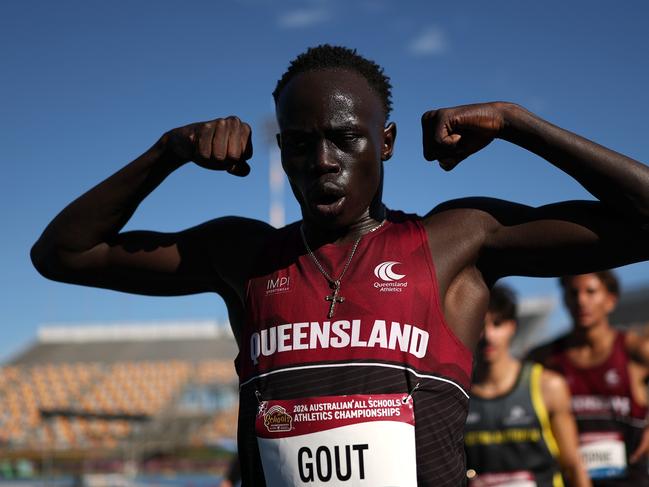 BRISBANE, AUSTRALIA - DECEMBER 07: Gout Gout of Queensland celebrates winning the Boys' U18 200m Final in a new national time of 20.04 seconds during the 2024 Chemist Warehouse Australian All Schools Athletics Championship at Queensland Sport and Athletics Centre on December 07, 2024 in Brisbane, Australia. (Photo by Cameron Spencer/Getty Images)