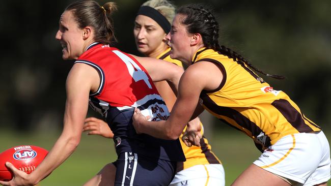 Darebin’s Karen Paxman is tackled by Box Hill’s Lauren Costello. Picture: Mark Dadswell