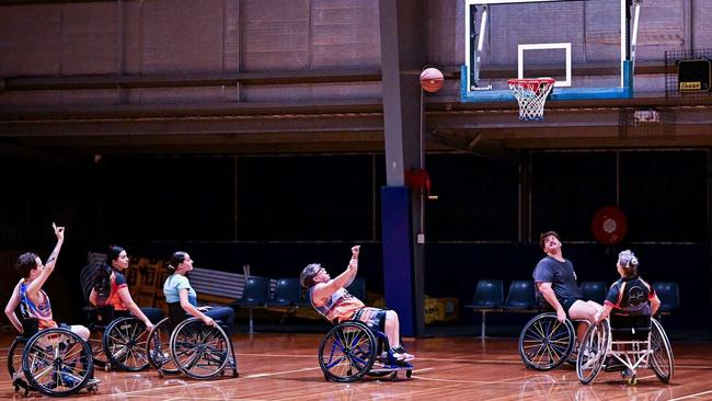 SunCity Wheelers founder Byron Holman (far left) celebrates a shot as it flies to the basket. Picture: Linda Bone Photographer