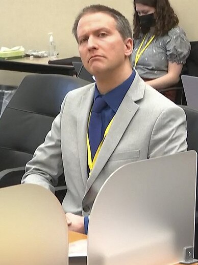 Derek Chauvin listens as his defence lawyer Eric Nelson gives closing arguments.