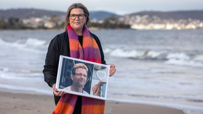 Vanessa Summers at Bellerive Beach with a picture of her late brother Andrew Grundy. Picture: Linda Higginson