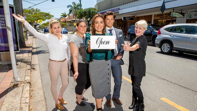 Traders Bekk Tombs, Sarah Dargahi, Ingrid Steven, Maxwell Steven and Leanne Hedges were featured in an October edition of City North News, asking Brisbane City Council for an entrance sign off Kingsford Smith Drive. (AAP Image/Richard Walker)