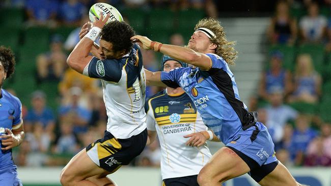 SPORT- Western Force v Brumbies at nib Stadium, Perth PICTURED - Brumbies flyhalf Zac Holmes marks the ball despite the efforts of Western Force's Nick Cummins