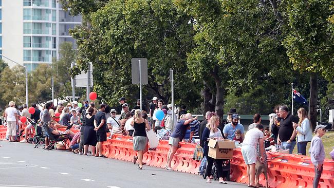 Families celebrate doing Father’s Day across barriers at Coolangatta. Picture: Richard Gosling.