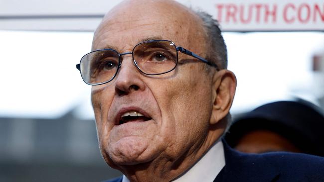 WASHINGTON, DC - DECEMBER 15: Rudy Giuliani, the former personal lawyer for former U.S. President Donald Trump, speaks with reporters outside of the E. Barrett Prettyman U.S. District Courthouse after a verdict was reached in his defamation jury trial on December 15, 2023 in Washington, DC. A jury has ordered Giuliani to pay $148 million in damages to Fulton County election workers Ruby Freeman and Shane Moss.   Anna Moneymaker/Getty Images/AFP (Photo by Anna Moneymaker / GETTY IMAGES NORTH AMERICA / Getty Images via AFP)