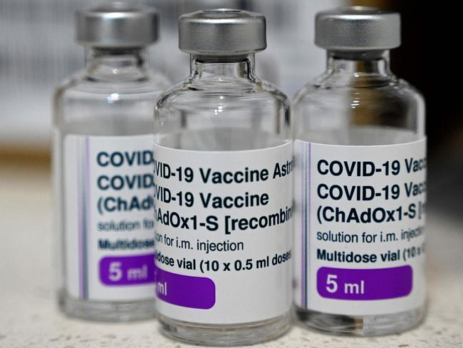 Empty vials of the AstraZeneca vaccine are seen on the counter at a walk-in Covid-19 vaccination centre at a pharmacy in the suburb of Cabramatta in Sydney on August 17, 2021. (Photo by Saeed KHAN / AFP)