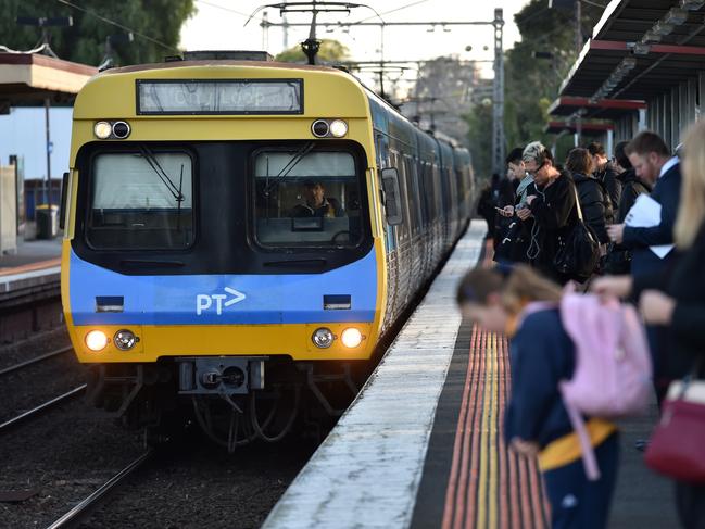 Peak hour commuters wait for a city loop train at Newmarket Station ahead of a train strike in Melbourne, Friday, Sept. 4, 2015. Close to 700 train services will be cancelled across Melbourne on Friday as part of the Rail, Train and Bus Union's rolling industrial action against Metro Trains. (AAP Image/Tracey Nearmy) NO ARCHIVING