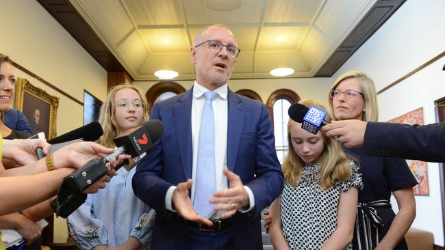 Former SA Premier Jay Weatherill speaks to the media after annoucing his resignation from politics in State Parliament on Thursday/ He’s with his daughters Lucinda and Alice and wife Melissa. Picture: AAP / Brenton Edwards