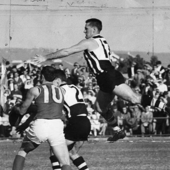 Port Adelaide captain Geoff Motley, right, during a game against West Torrens at Thebarton Oval in May 1966.