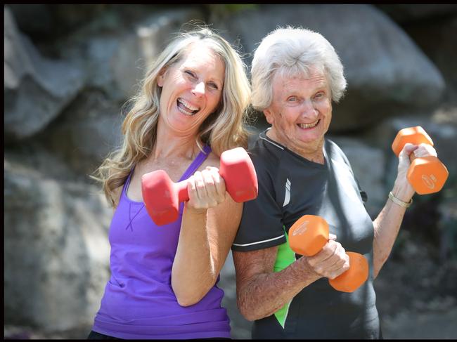 Brisbane resident Beryl Young, 83, does exercise classes three times a week, plays table tennis almost every day and getsout on the gold course twice a week with trainer  Peta from  Green strong healthy women Pic Jamie Hanson