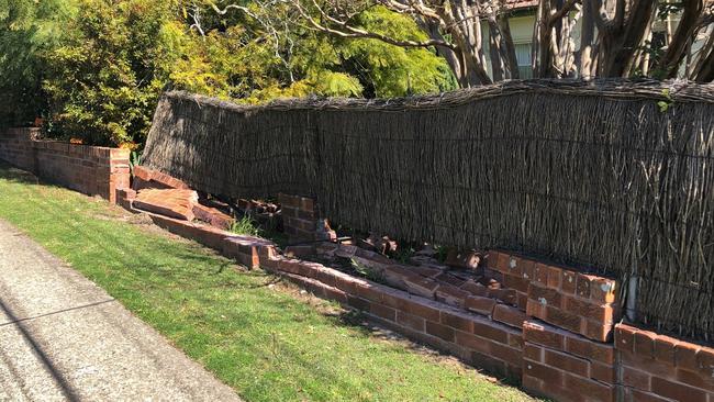 The damaged brick boundary fence at the home of Pam Ridden at the intersection of Pringle and Haigh avenues at Belrose, after a driver lost control of his car late last week. Picture: Jim O'Rourke