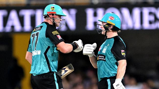 BRISBANE, AUSTRALIA - JANUARY 06: Max Bryant and Matt Renshaw of the Heat pump fists during the BBL match between Brisbane Heat and Sydney Thunder at The Gabba, on January 06, 2025, in Brisbane, Australia. (Photo by Bradley Kanaris/Getty Images)