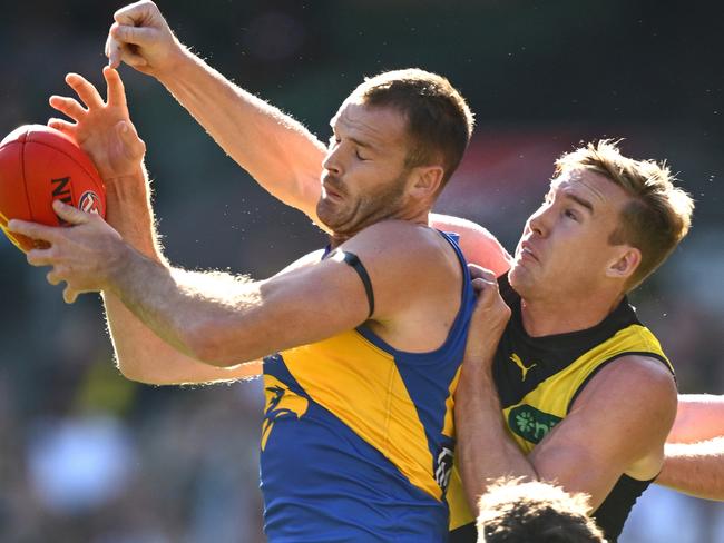 MELBOURNE, AUSTRALIA - MAY 11: Matt Flynn of the Eagles and Tom Lynch of the Tigers compete for a mark during the round nine AFL match between Richmond Tigers and West Coast Eagles at Melbourne Cricket Ground, on May 11, 2025, in Melbourne, Australia. (Photo by Quinn Rooney/Getty Images)