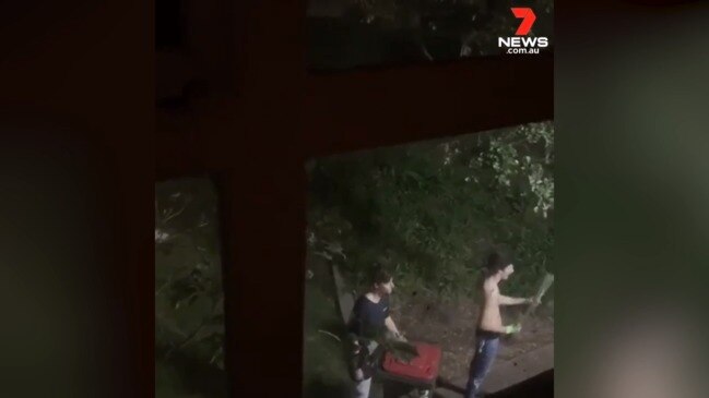 Mob with swords, axes lurk outside Housing Trust block (7 News)