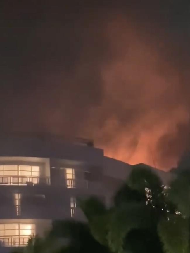 A video posted to social media shows a fireball above the Cairns hotel after Mr Wilson crashed a helicopter into its roof.