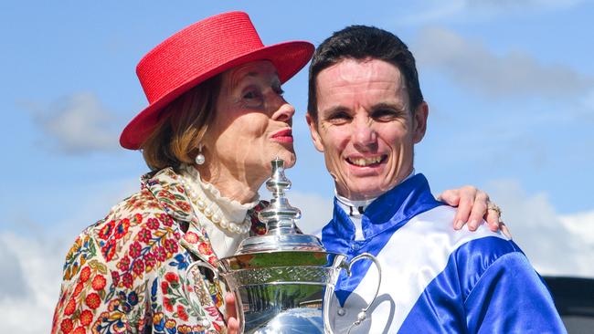 Tim Clark gets a kiss from Gai Waterhouse after scoring the Group 1 Might And Power at Caulfield. Picture: Getty Images.