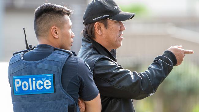 A victim speaks to police at the scene. Picture: Jay Town