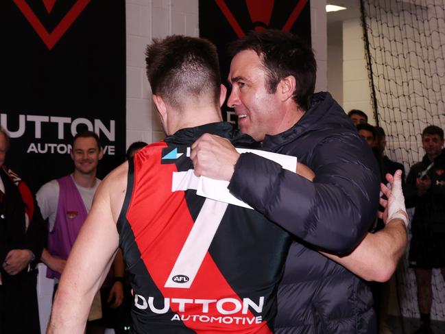 MELBOURNE, AUGUST 4, 2024: 2024 AFL Football - Round 21 - Essendon Bombers V Fremantle Dockers at the MCG. Brad Scott coach of the Bombers celebrates the win with Zach Merrett of the Bombers. Picture: Mark Stewart
