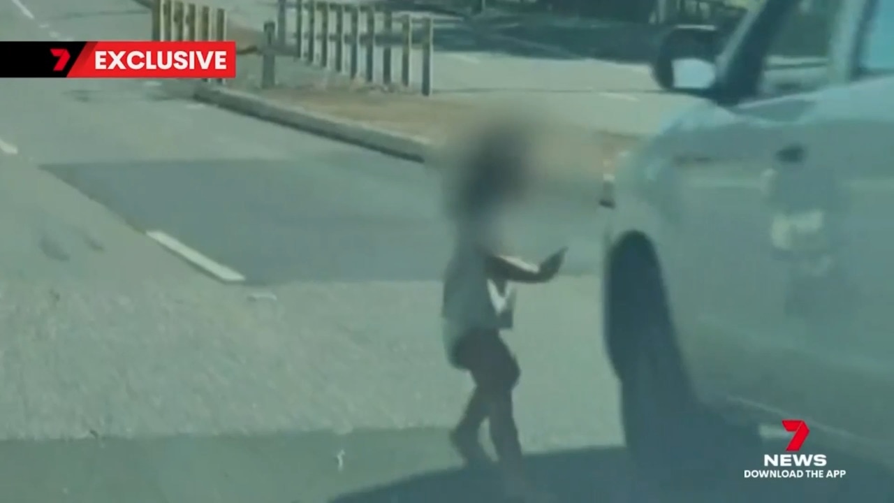 Toddler narrowly misses car