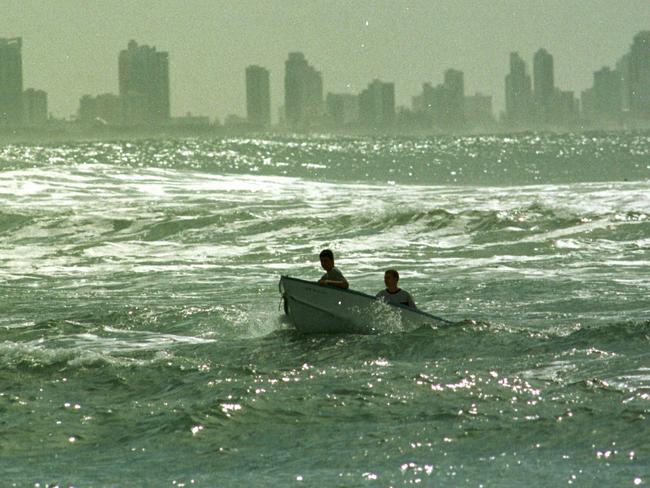 1999: Boys having fun in their dinghy near the bar at Currumbin.