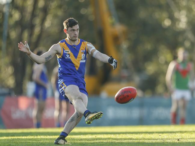 Tom Marks takes a kick for Cranbourne last season. Picture: Valeriu Campan