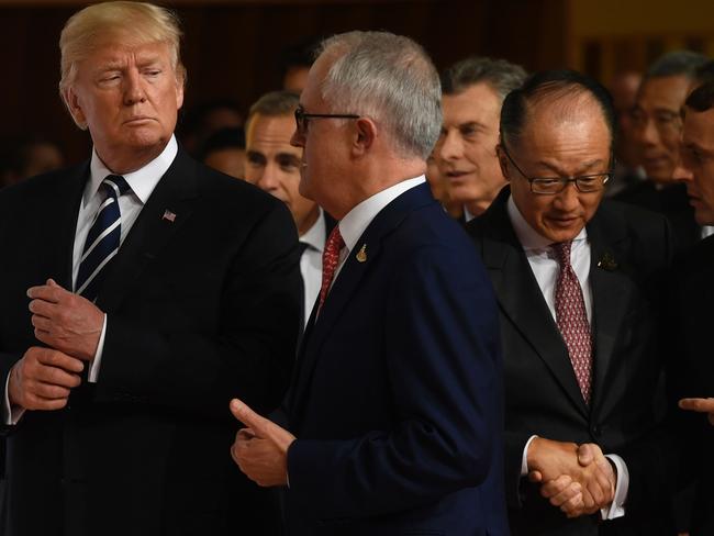 Trump talks with Malcolm Turnbull while walking in to have their photos taken Picture: AFP PHOTO / SAUL LOEB