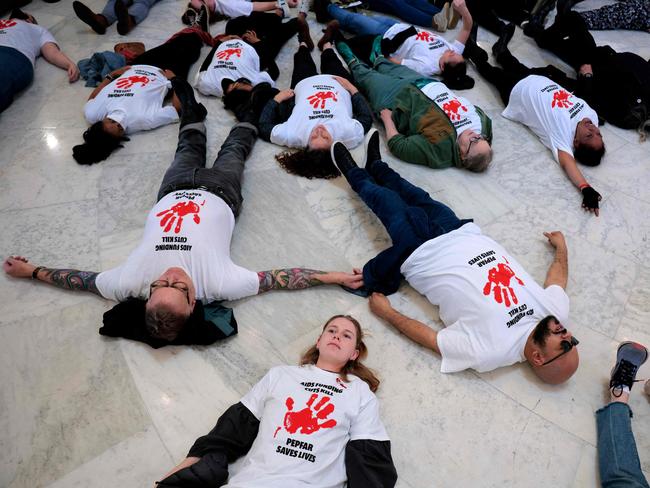 Demonstrators, some of them former USAID employees, hold a die-in to demand that Congress stand up to President Donald Trump and Elon Musk's gutting of foreign aid. Picture: Getty Images via AFP