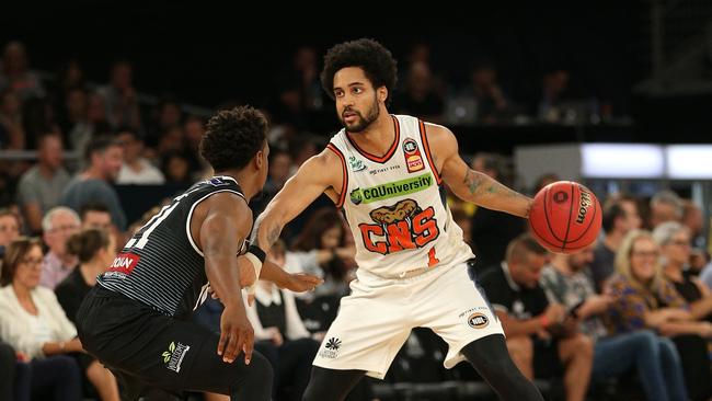 Melo Trimble of Cairns (right) under pressure from Casper Ware of Melbourne during the Round 18 NBL match between Melbourne United and the Cairns Taipans at Melbourne Arena in Melbourne, Thursday, February 14, 2019. (AAP Image/Hamish Blair) NO ARCHIVING, EDITORIAL USE ONLY