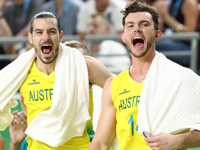 GOLD COAST, AUSTRALIA - APRIL 15:  Australia guard/forward Chris Goulding (4) and Australia forward Angus Brandt (14) celebrate during the Men's Gold Medal Basketball Game between Australia and Canada on day 11 of the Gold Coast 2018 Commonwealth Games at Gold Coast Convention and Exhibition Centre on April 15, 2018 on the Gold Coast, Australia.  (Photo by Ryan Pierse/Getty Images)