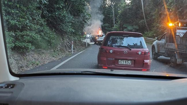 Passengers travelling up the Kuranda range road have narrowly escaped injury as the car they were travelling in caught fire quickly becoming engulfed in flames. Photo: Vi Petersen