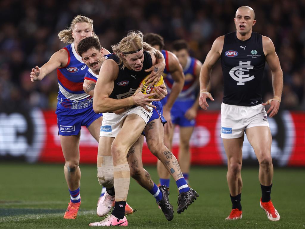 Tom Liberatore tackles Tom De Koning. Picture: Darrian Traynor/AFL Photos/via Getty Images