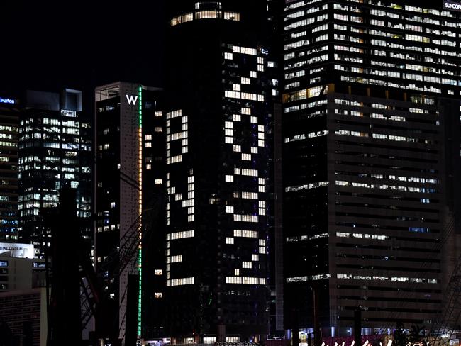 Lights on a CBD office building spell '’BNE 2032'“ after it was announced that Brisbane will host the 2032 Olympic Games at Southbank in Brisbane. Picture: NCA NewsWire / Dan Peled