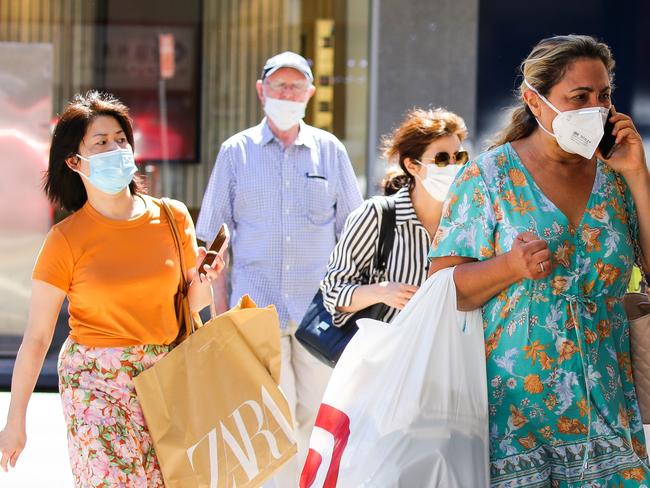 SYDNEY, AUSTRALIA - NewsWire Photos JANUARY, 11, 2021: People seen wearing face masks while walking through the central shopping district of Chatswood inline with the new rules on mandatory mask wearing for Covid-19 in Sydney, Australia. Picture: NCA NewsWire / Gaye Gerard