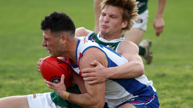 Adam Valeri is tackled by Angus Seivers. Picture: George Sal