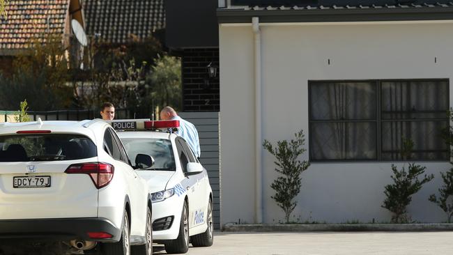 Police at the Campsie home of missing Qi Yu.  Picture: Richard Dobson