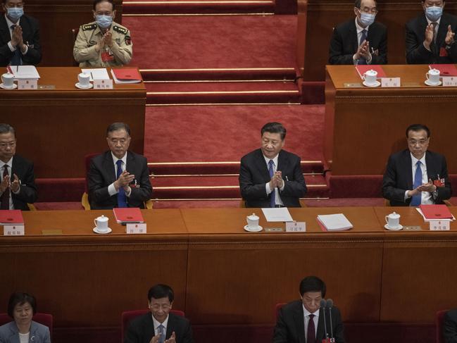 Chinese president Xi Jinping, centre, and members of the government applaud after the results of a vote on a new draft security bill for Hong Kong. Picture: Getty Images