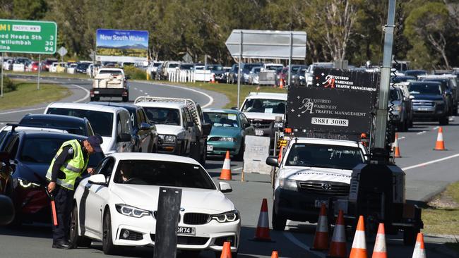 Police check cars at the Queensland border with NSW at Stuart Street at Coolangatta after Sydney was declared a hotspot. Picture: NCA NewsWire / Steve Holland