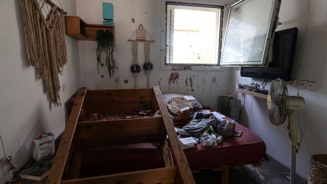 Blood stains are spread on the wall of a bedroom in kibbutz Kfar Aza in southern Israel near the Gaza Strip. Picture: AFP