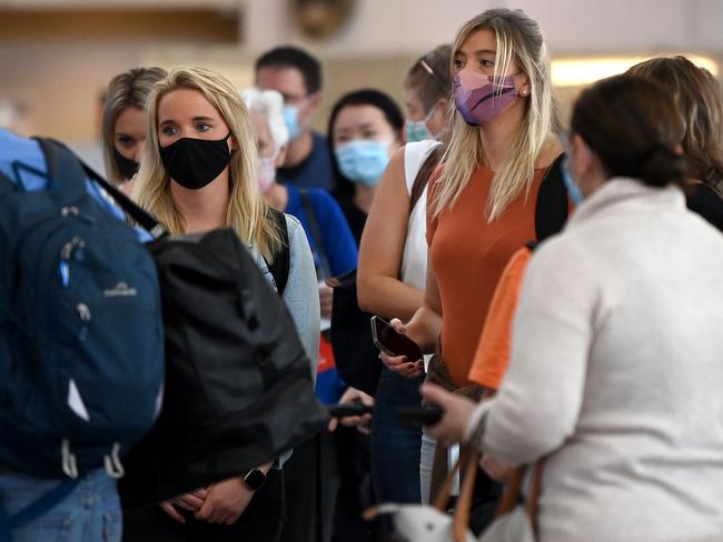 People wearing face masks to help prevent the spread of COVID-19 at Sydney Domestic Airport. Picture: NCA NewsWire/Bianca De Marchi