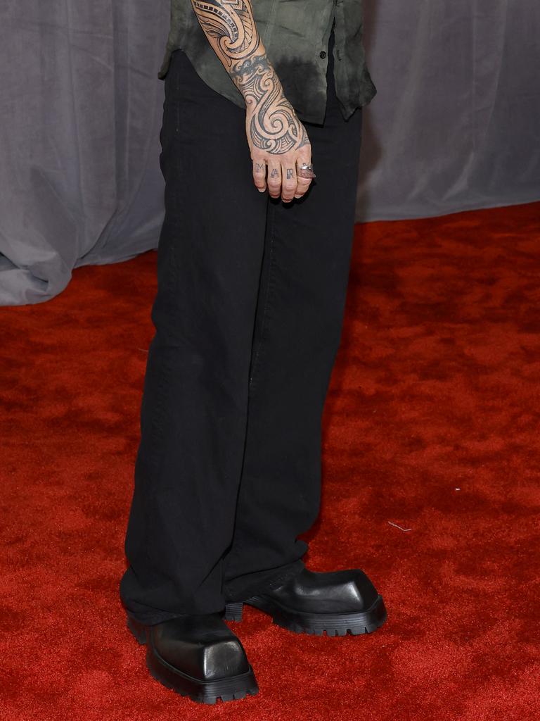 The singer was sporting some rather large shoes to the awards. Picture: Jason Kempin/Getty Images via AFP