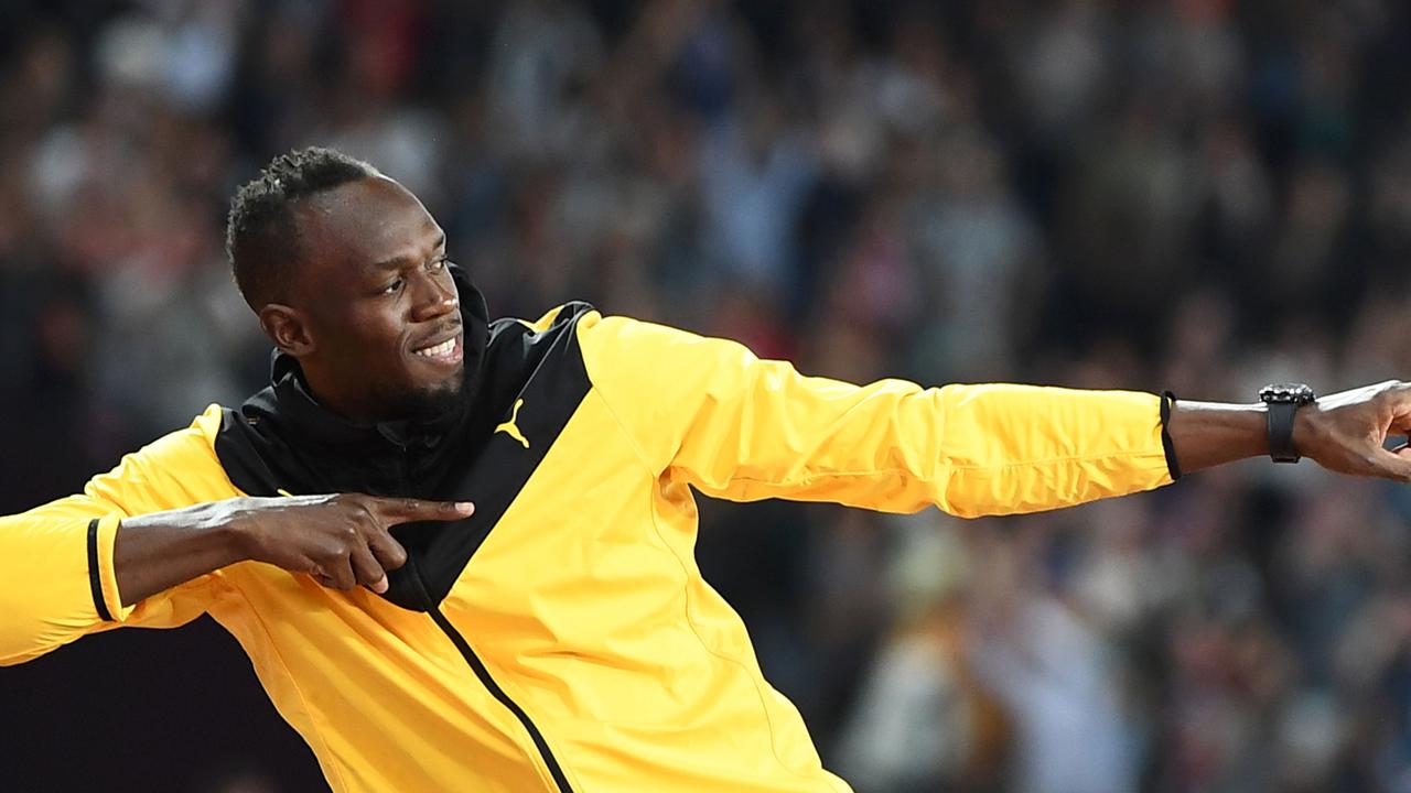 TOPSHOT – Jamaica's Usain Bolt does his trademark gesture