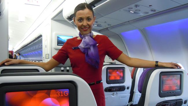 Flight attendant Louise McNamara in the new Virgin Australia A330 economy cabin. Pic Steve Creedy.