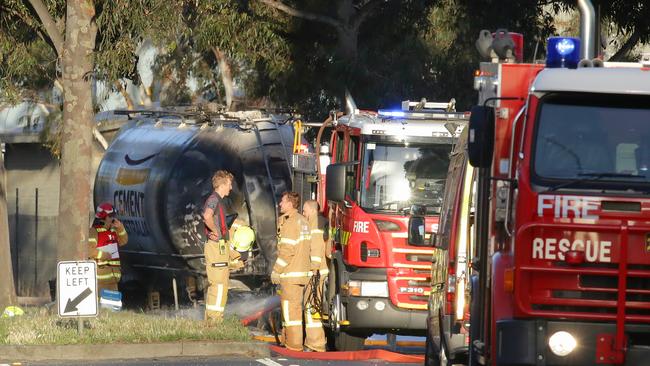 Firefighters on the scene of a truck fire in Port Melbourne. Pictures: Hamish Blair